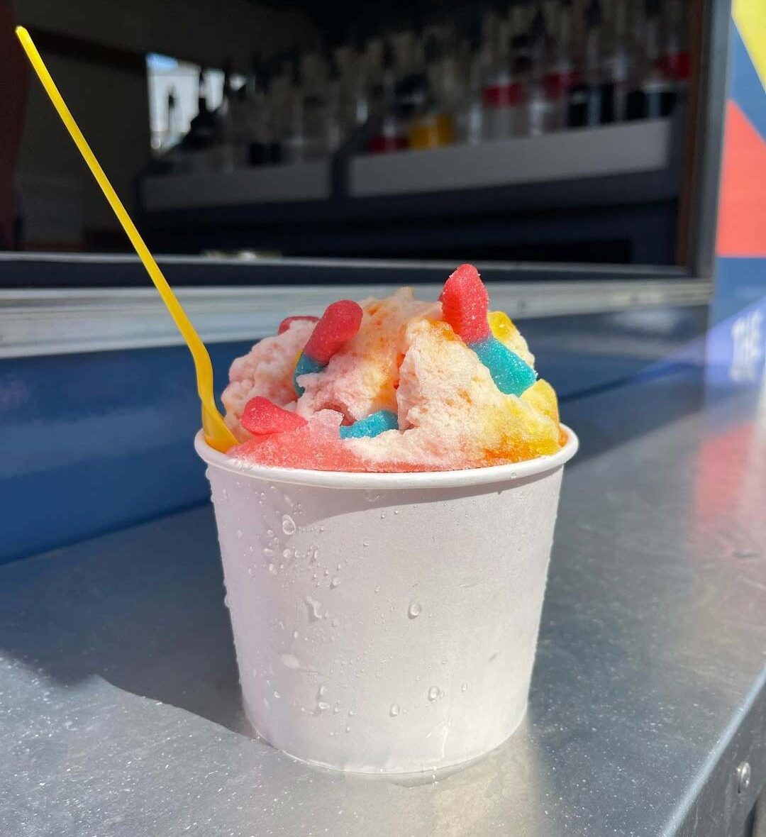 Frozen treat with gummy worm toppings from a gourmet shaved ice vendor in Piedmont, SC